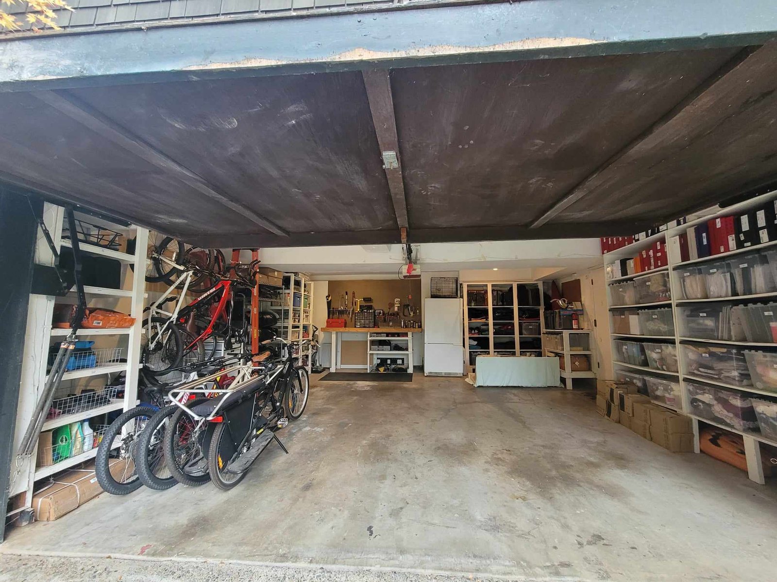 After organization image of garage with tons of floor space and everything neatly categorized, organized, and binned