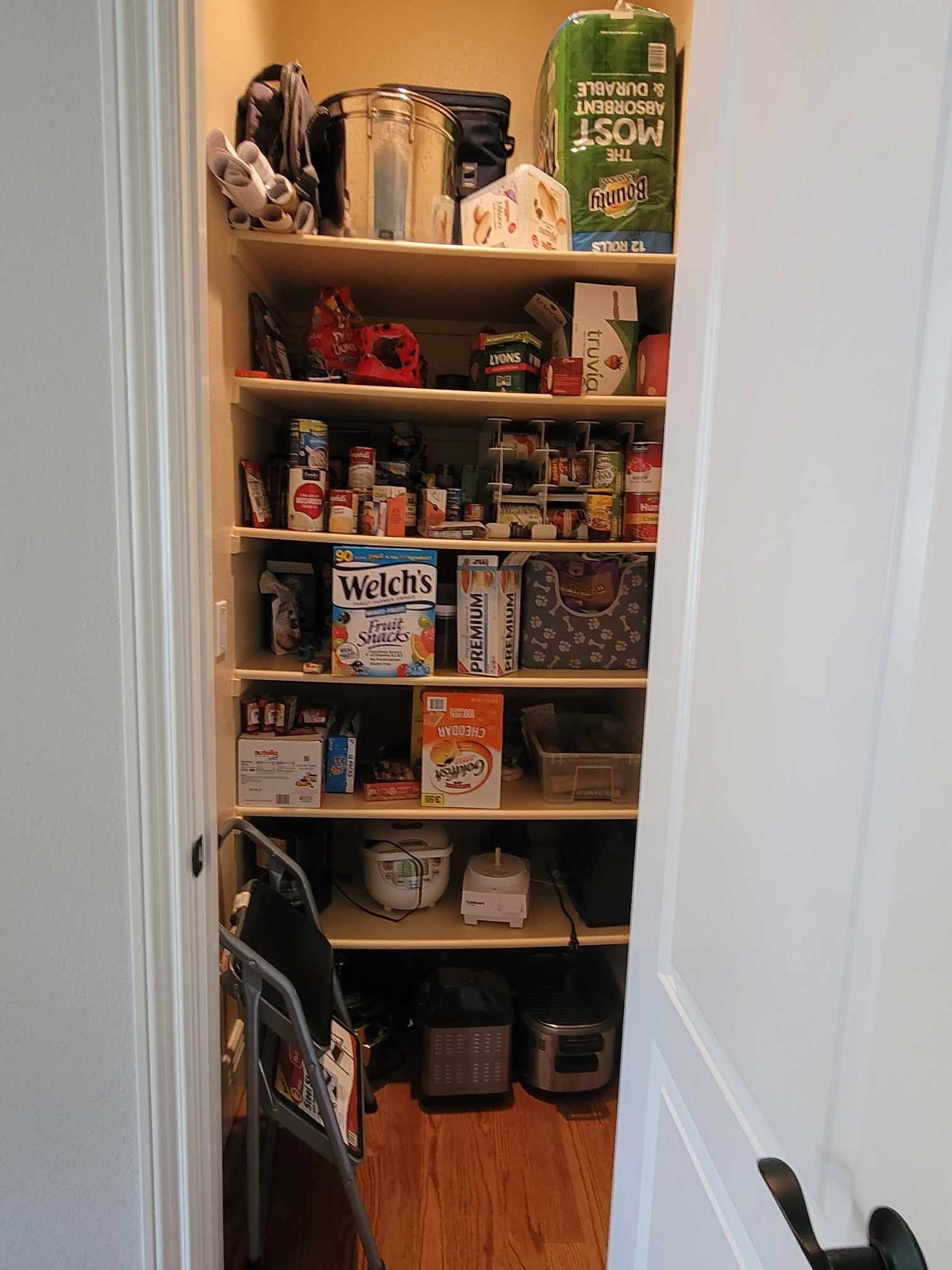 Before organization image of pantry with everything hidden and hard to find