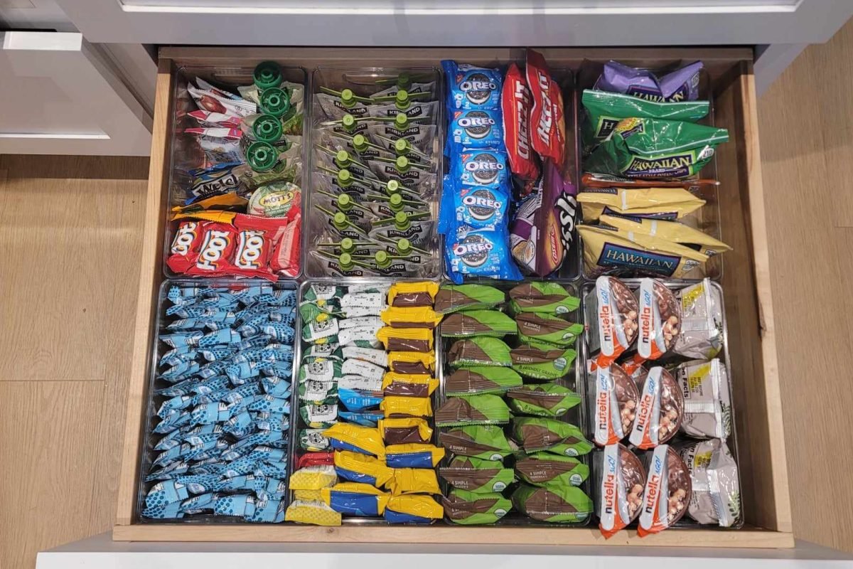 Snack drawer with various snacks neatly organized, lined up, and binned